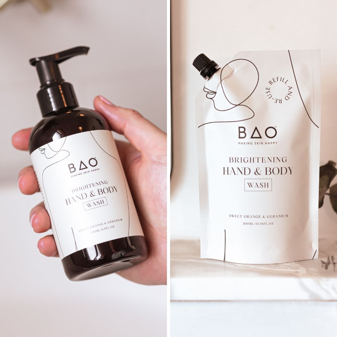 Hand holding BAO Brightening Hand & Body Wash bottle next to its refill pouch