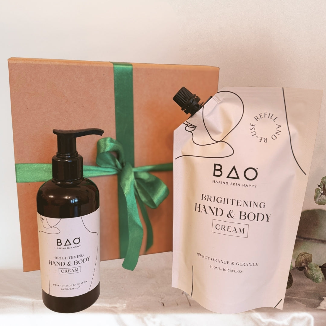BAO brightening hand and body cream bottle and packaging with a gift box on a white surface.