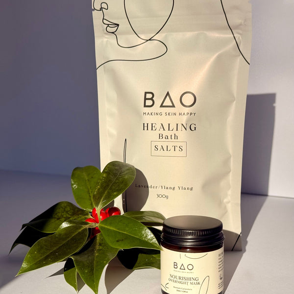 Bao Healing Bath Salts packaging with a small container and leaves on a light background