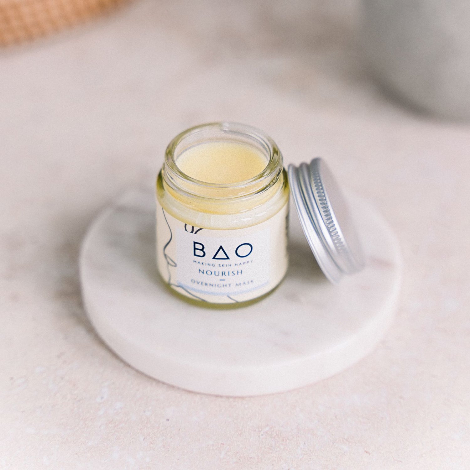 Nourish overnight mask organic balm on a product stand