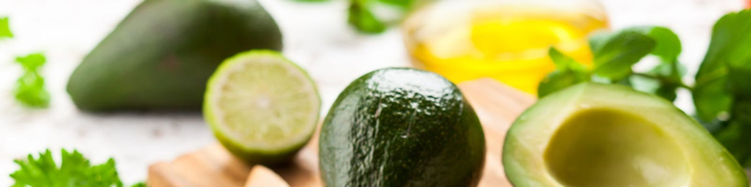 Organic avocado ingredients on a bamboo chopping board