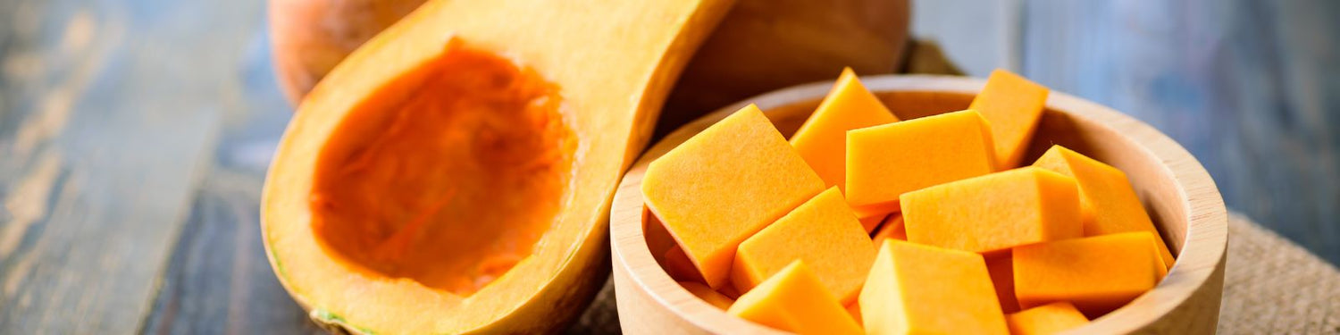 Chopped butternut squash in a bamboo bowl