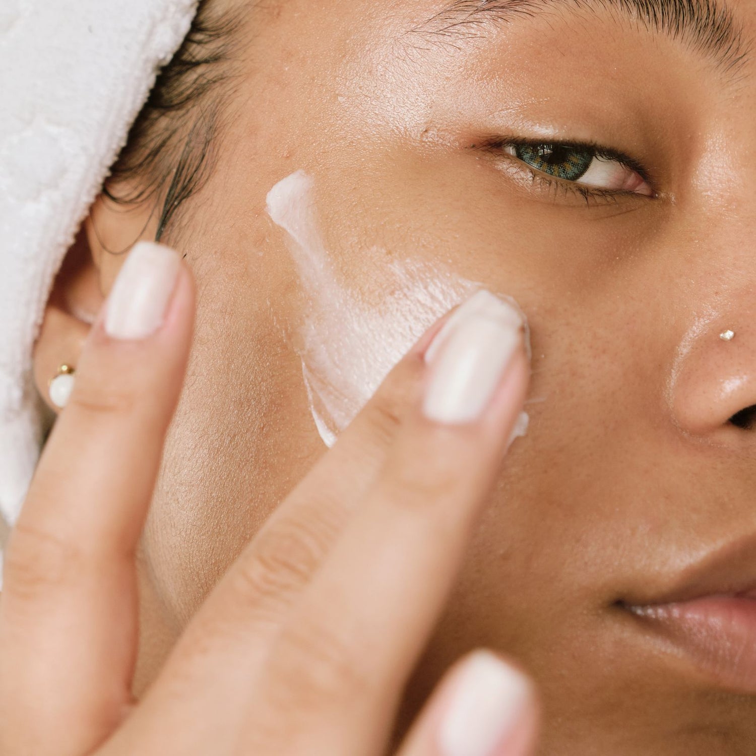 Woman using natural face cream