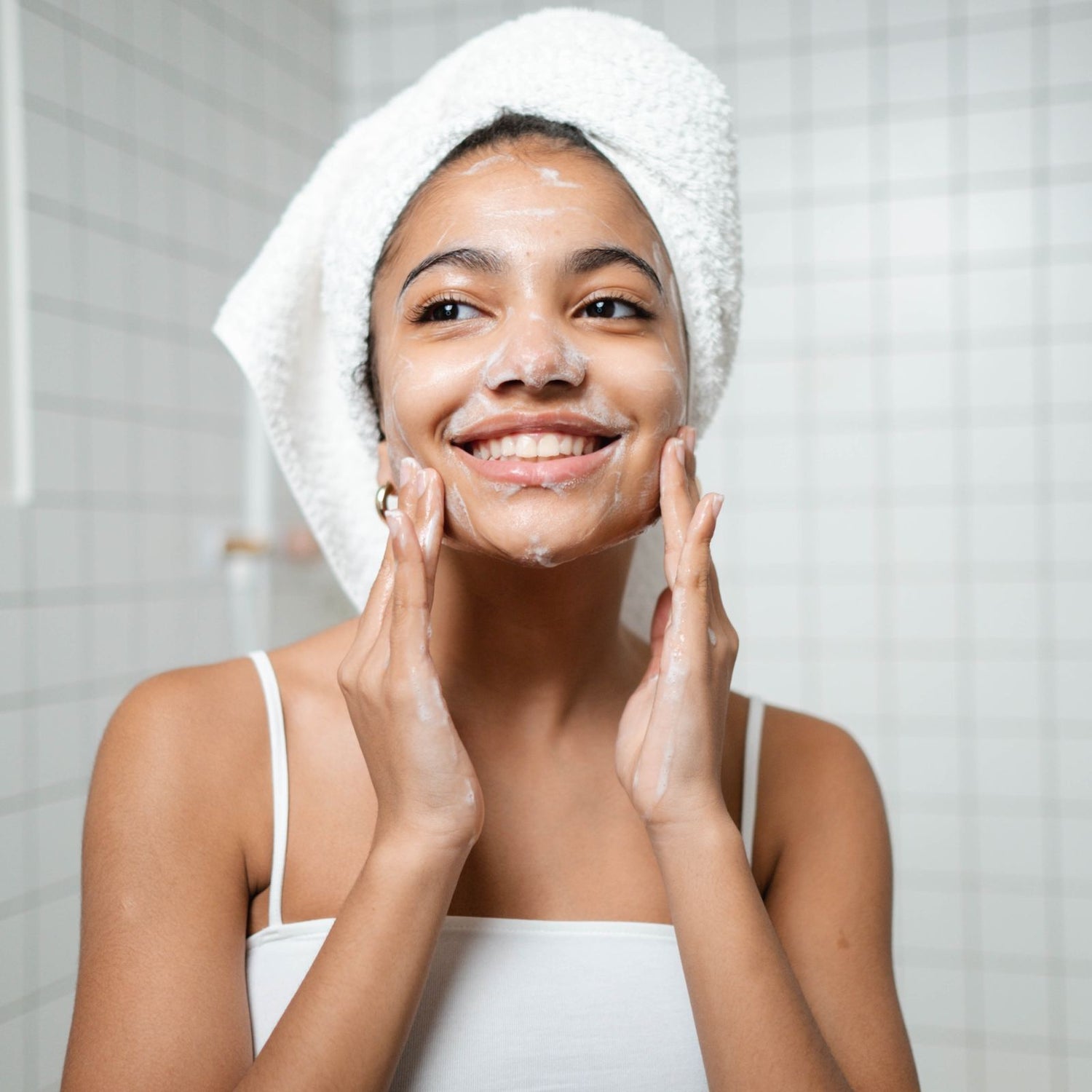 Woman washing her face with natural, organic face wash.