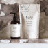 BAO Healing Bath Salts and Bath & Body Oil on a marble surface with a marble background